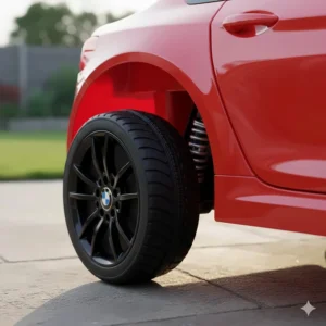 Close-up of the wear-resistant EVA rubber tyres and rear-wheel suspension on a BMW toy car.