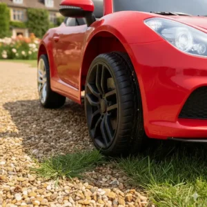 Durable anti-slip tyres of a ride-on toy suitable for British gardens, grass, and gravel driveways.