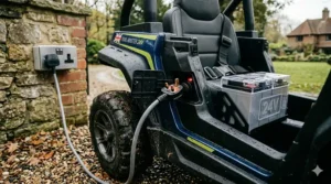 A 24v rechargeable battery pack being charged via a standard UK 3-pin wall socket for a children's ride-on.