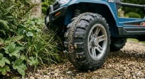 Detailed shot of the high-grip EVA rubber tyres designed for UK garden surfaces like wet grass and gravel.