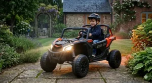Front view of the Can-Am Maverick ride-on toy with bright working LED headlights illuminated in an outdoor setting.