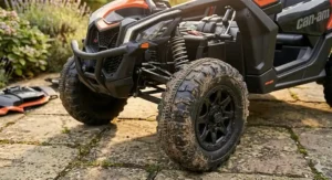 Close-up of the rugged tread on the EVA tyres of a Can-Am Maverick ride-on, demonstrating traction on typical UK garden surfaces.