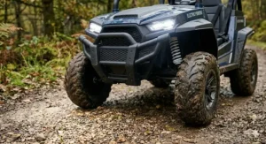 Working LED headlights on the front of an off-road electric buggy for increased visibility during outdoor play.