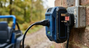 A 24V rechargeable battery pack with a UK 3-pin plug charger for an electric off-road kart.