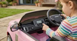 A powerful pink 4x4 ride-on car for girls showing off-road performance on a green lawn.