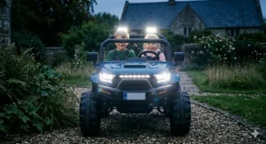 The front of the 24V buggy showing functional bright LED headlights and spotlights for better visibility during play.