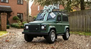 Miniature licensed Land Rover ride-on car for kids, finished in hunter green for a classic British look.
