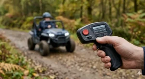 A handheld parental remote control used to limit the speed of a children's electric buggy.