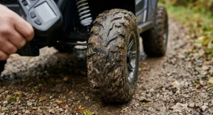 Detailed view of high-grip knobby tyres designed for UK mud and gravel surfaces.