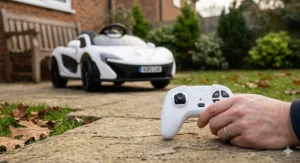 White ride-on sports car showing the parental remote control handset used for safety during Christmas play.