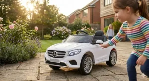 A toddler-friendly 12V motorised ride-on car for girls with a simple foot pedal and easy-grip steering.