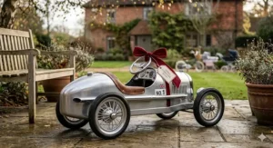 Classic silver metal vintage-style racing car for kids, perfect as a keepsake Christmas gift.