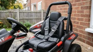 Interior view of a 24v electric go kart featuring a secure five-point safety harness and a protective black roll bar.