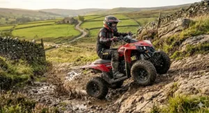 Side view of a 24v quad bike demonstrating high torque while climbing a steep and rocky hill in the British dales.