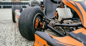 Side view of an electric racing drift kart designed for teenagers, featuring a sturdy steel frame.
