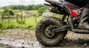 A side-by-side comparison between an electric kids sport quad bike and a petrol model, showing differences in power delivery and maintenance requirements.