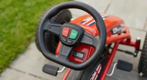 The dashboard and steering wheel of a 12V go kart for kids featuring a working horn and built-in music player.