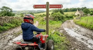 A display of a kids sport quad bike in various colour options including racing red, cobalt blue, and lime green.