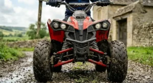 A detailed view of the handlebar on a kids sport quad bike showing the adjustable screw used for the parental speed control.