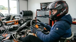 Two teenagers racing drift karts on a wide private driveway in the UK.