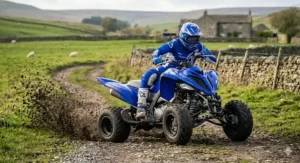 A sport quad bike navigating a sharp corner on an off-road track, demonstrating its agile handling and lightweight frame.
