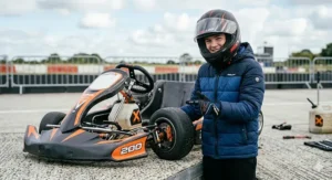 A 14-year-old sat comfortably in a racing drift kart to show the ergonomic fit for teenagers.