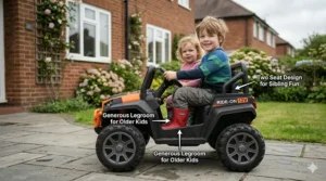 An electric ride-on buggy with chunky tyres being driven on a paved path in a UK public park.