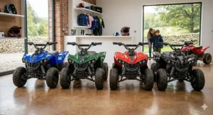 A row of electric quads for boys in different colours, including racing blue, British racing green, classic red, and gloss black.