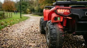 A view of the rear storage rack on a kids' electric quad bike, perfect for carrying small toys during outdoor play.