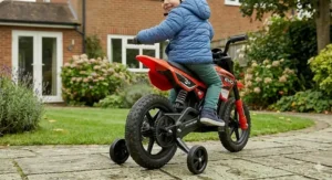 Detailed view of the high-traction rubber tyres on a kids' electric motorbike suitable for patios and garden paths.