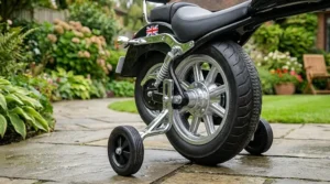 Foot-operated accelerator pedal on the 12v cruiser-style electric motorcycle for intuitive speed control.