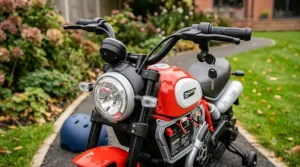 Front view of a licensed electric motorcycle for kids showcasing the LED headlight and handlebars.