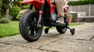 Close-up of the durable rubber tyres on a kids electric motorbike.