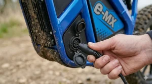 Durable, treaded pneumatic tyres on a 24v electric dirt bike for off-road use.