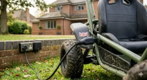 A 3-pin plug charging lead connected to an off-road ride-on toy for convenient home charging.
