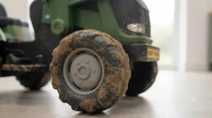 Close-up of the puncture-proof EVA soft tyres on the 24v ride on tractor.