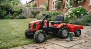 A multi-function ride-on tractor sitting on a patio, built with durable materials for outdoor UK weather.