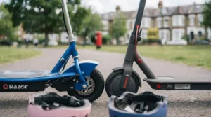 Close-up detail of essential safety features on a children's electric scooter, including the disc brake on the blue seated model and the rear light on the black standing model.
