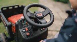 Close-up of the dashboard on a multi-function ride-on tractor showing the realistic steering wheel and control buttons.