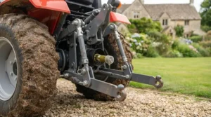 The rear-mounted three-point hitch system used for connecting various agricultural implements.