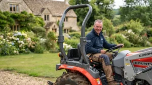 Robust rollover protection structure (ROPS) fitted to a ride-on tractor for operator safety.