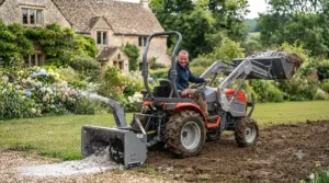 A versatile ride-on tractor with loader used for clearing snow from a private driveway.