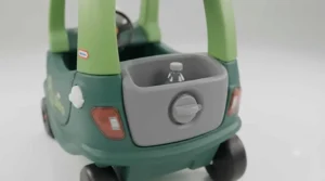 Rear storage slot and cup holders built into the back of the Cozy Coupe Dino ride-on.