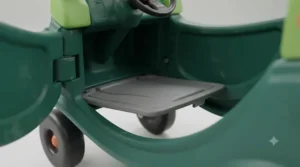 Interior of the Cozy Coupe Dino highlighting the removable floor board for parent-controlled push rides.