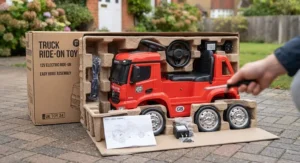 Unboxed components and chassis of a children's ride-on toy truck ready for home assembly