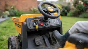 Close-up of the steering wheel, accelerator pedal, and sound effects dashboard on an electric ride-on dumper truck.