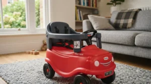 Close-up of safety guards and anti-tip features on a popular first ride-on car for toddlers.