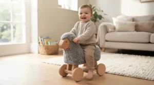 Happy toddler playing safely on a sturdy wooden animal ride-on on a living room rug.