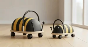 Small and large Wheelybug bee models displayed together to show scale differences for toddlers and children.