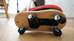 Close-up of the softly padded seat and sturdy aluminium handlebar on the Wheelybug ladybird.